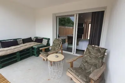 a living room with a couch and chairs and a table at Casa Carlu Maria II in Corte