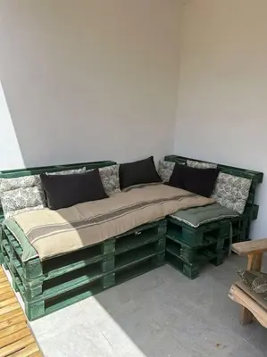 a bed sitting in the corner of a room at Casa Carlu Maria II in Corte