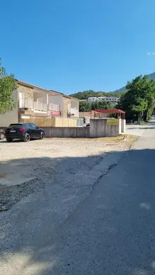 a car parked in a parking lot next to a building at Casa Carlu Maria II in Corte