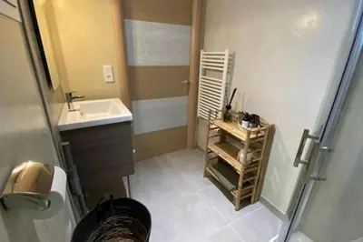 a small bathroom with a sink and a mirror at Casa Carlu Maria II in Corte