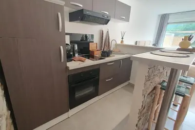 a kitchen with a stove and a counter top at Casa Carlu Maria I in Corte
