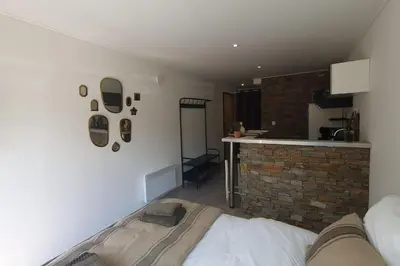 a bedroom with a bed and a brick wall at Casa Carlu Maria I in Corte