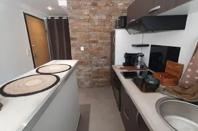 a kitchen with a counter and a sink and a counter top at Casa Carlu Maria I in Corte