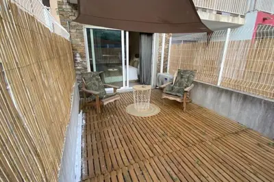 a patio with chairs and a table and an umbrella at Casa Carlu Maria I in Corte