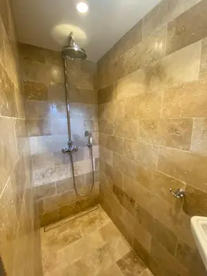 a bathroom with a shower and a sink at Les Bergeries de Pinarello, Capellina in Zonza