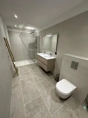 a bathroom with a toilet and a sink at Résidence du Château d'eau in Porticcio