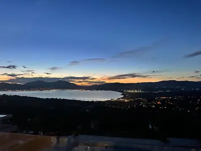 a view of a large body of water at sunset at Résidence du Château d'eau in Porticcio
