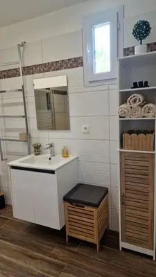 a bathroom with a sink and a mirror at Casa Figarella in Calenzana