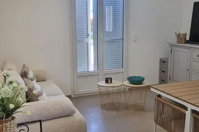a living room with a couch and a table at Casa Figarella in Calenzana