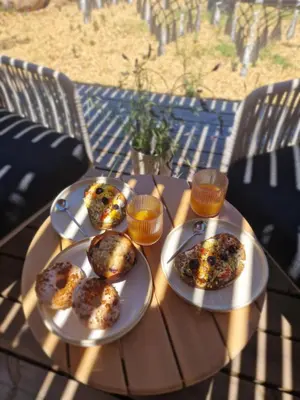 a table with two plates of muffins on it at Casa Figarella in Calenzana