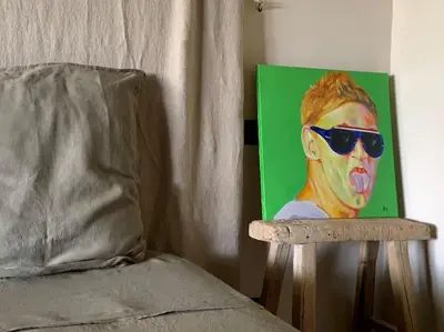 a painting of a woman wearing sunglasses with her tongue at Villa Pieds dans l eau in Porto-Vecchio