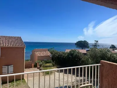 a view of the ocean from the balcony of a house at Appartement T3 Vue mer in Conca