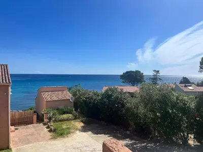 a view of the ocean from a house at Appartement T3 Vue mer in Conca