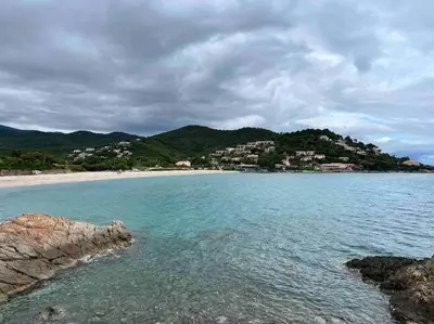 a view of a beach with houses on a hill at Appartement T3 Vue mer in Conca