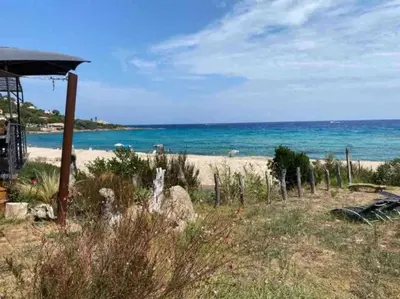 a view of a beach with the ocean in the background at Appartement T3 Vue mer in Conca