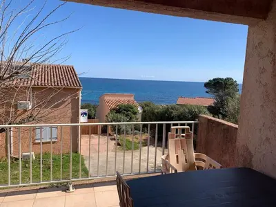 a view of the ocean from the balcony of a house at Appartement T3 Vue mer in Conca