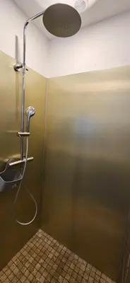 a shower stall in a bathroom with a glass door at T2 Résidence Dolce & Vita C4 vue mer et piscine in Propriano