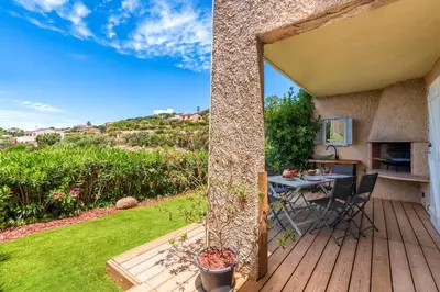 a view from the deck of a house with a table at Libertà - Appt à porticcio climatisé proche plage in Grosseto-Prugna