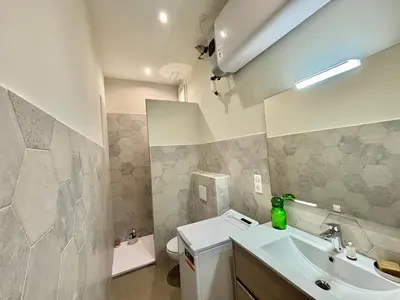 a bathroom with a sink and a toilet at Appartement studio cours napoleon Ajaccio in Ajaccio