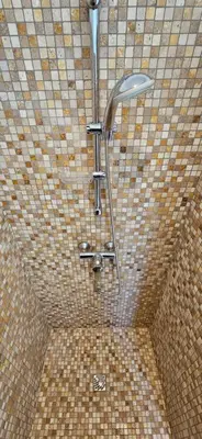 a shower in a bathroom with a tiled ceiling at T3 de standing Vigna Majo vue mer imprenable in Propriano