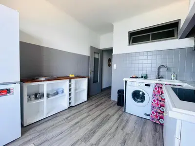 a laundry room with a washer and dryer at Front de mer Beau T3 climatisé Balcon Parking Ajaccio in Ajaccio