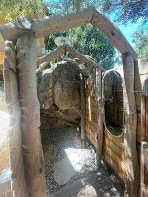 an entrance to a zoo with a wooden structure at A Malgrana - Tente lodge hébergement insolite in Coti-Chiavari