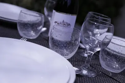 a group of wine glasses sitting on a table at Perla Di Macchia in Bonifacio