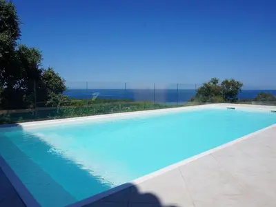 a swimming pool with a view of the ocean at Villa Villa Orizonte by Interhome in Favone