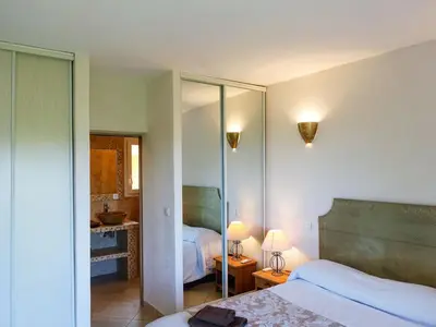 a hotel room with two beds and a bathroom at Villa Villa Orizonte by Interhome in Favone