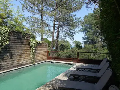 a body of water next to a rocky beach at Apartment Les Jardins d'Ève- F3 by Interhome in Favone
