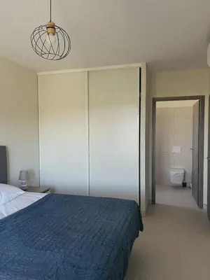 a bathroom with a toilet and a sink at Appartement spacieux 6 personnes sur le vieux port in Porto-Vecchio