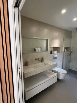 a bathroom with a sink and a toilet at Perla Bianca in Bonifacio