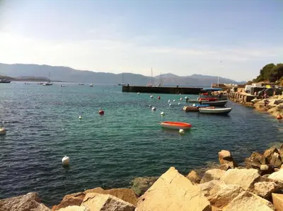 a group of boats in a body of water at Rez de villa, vue panoramique mer et montagne ! in Vico