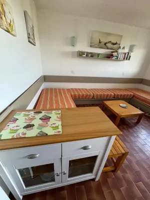 a living room with a couch and a table at Bella Vista 42, T2 vue mer piscine Porticcio in Porticcio