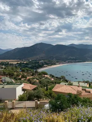 a view of a body of water with mountains at Chambre indépendante dans villa bord de mer in Vico