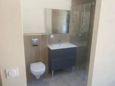 a bathroom with a toilet and a sink and a shower at Casa Missia in Porto-Vecchio