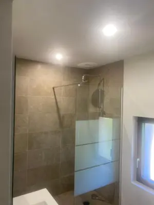a shower with a glass door in a bathroom at Casa Missia in Porto-Vecchio