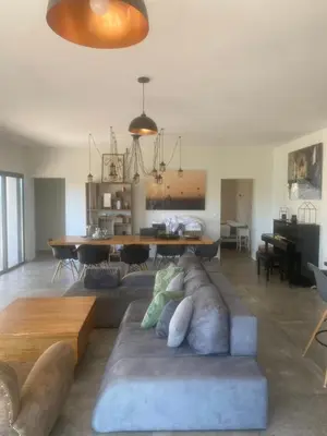 a living room with a couch and a table at Casa Missia in Porto-Vecchio