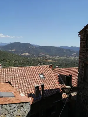 a street with cars parked on the side of the road at 10mn des plages - Olmeto village App 4P in Olmeto
