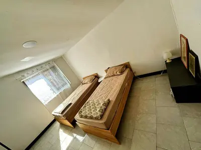 a bedroom with a bed and a window at A casetta di l alivu in Lucciana