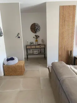 a living room with a couch and a table at Villa standing Arciquadra Porto Vecchio in Lecci