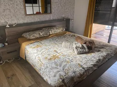 a bedroom with a large bed with at Villa standing Arciquadra Porto Vecchio in Lecci