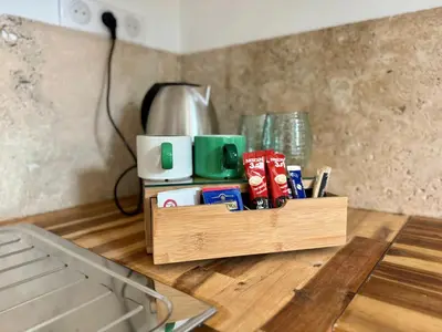 a wooden tray with items on top of a table at Chambre de charme à Evisa in Evisa