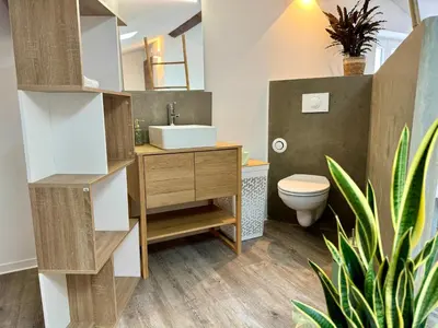 a bathroom with a sink and a toilet at Chambre de charme à Evisa in Evisa