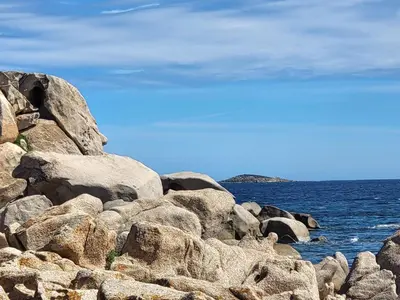 a group of rocks on the shore of the ocean at BandB les rosiers - chambre Garance in Conca