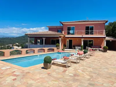 a villa with a swimming pool in front of a house at Villa Sì- Villa indépendante 3 chambres avec piscine et magnifique vue mer en plein centre de Porticcio in Porticcio