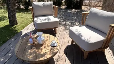 two chairs and a coffee table on a patio at Bergerie Piana d'architecte neuve, 8 pers, piscine chauffée, à 10 min plage in Gialla