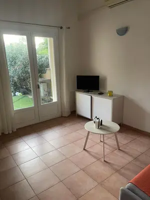 a living room with a table and a tv at A casa di Leia in Borgo