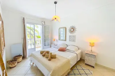 a bedroom with a bed with two teddy bears on it at Villa de Prestige - clim - vue mer panoramique - 8 pers - 4 chambres in Pietrosella