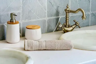 a bathroom counter with two sinks and a faucet at Villa de Prestige - clim - vue mer panoramique - 8 pers - 4 chambres in Pietrosella